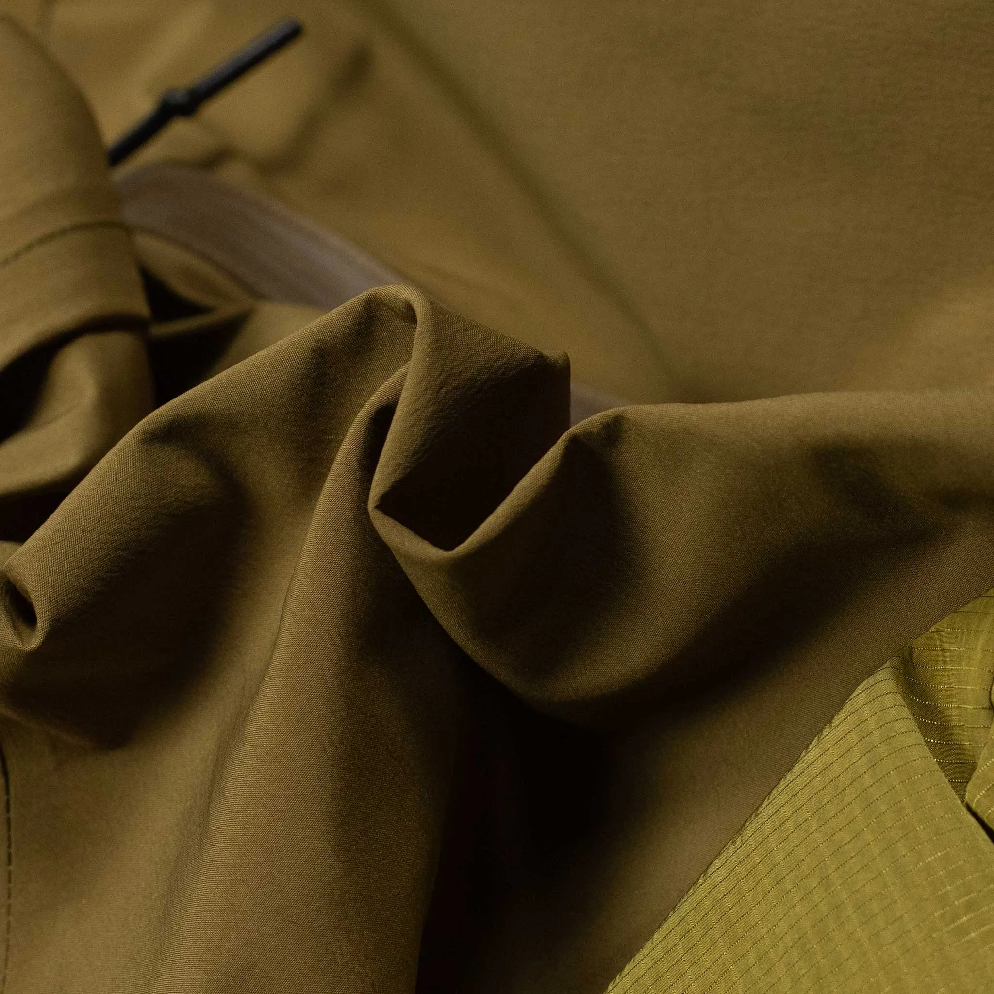 All-weather shell jacket in coyote brown and green nylon